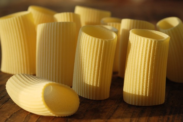 Dry pasta | Ridged Paccheri on a wooden board, at sunset | photo ©ockstyle